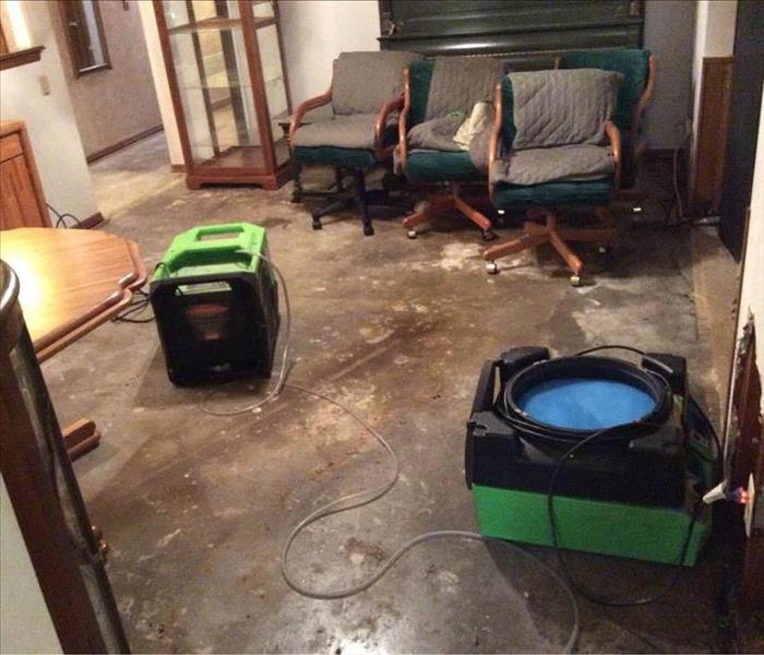 Green equipment on floor.