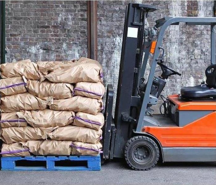Sand bags and and a lift truck